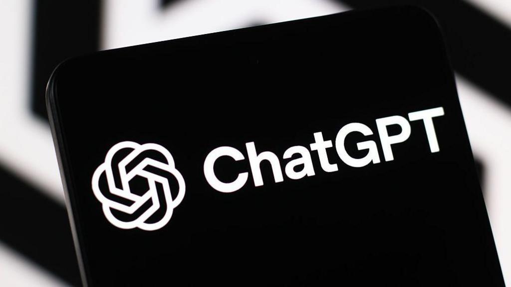 The black and white ChatGPT logo on a phone screen