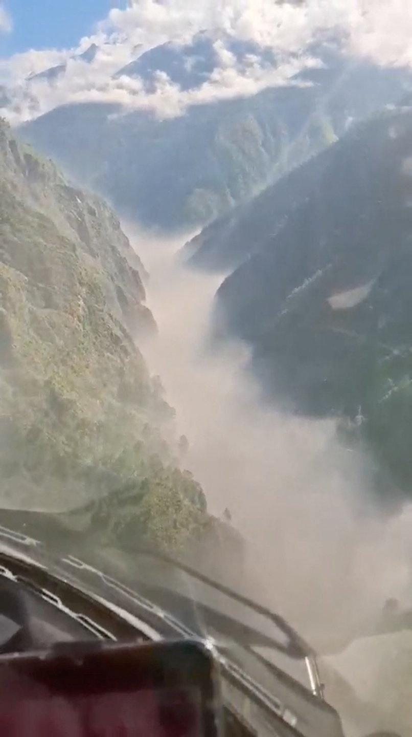Helicopter footage shows flash flooding in the valleys in Rasuwa, Nepal, August 26, 2026, in this screengab taken from a handout video.