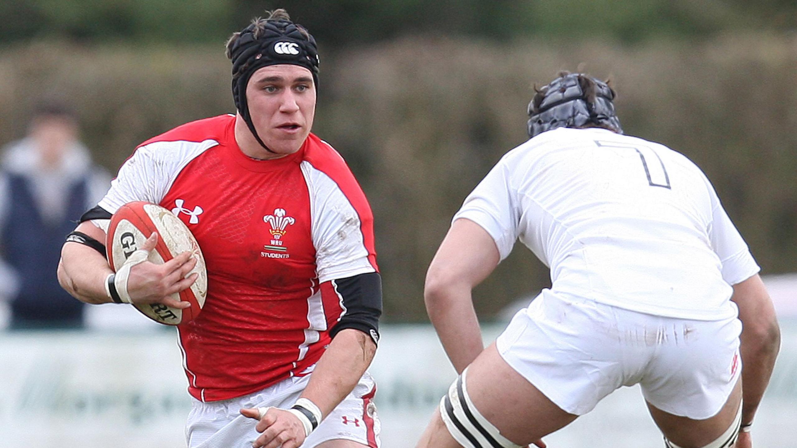Kyle Tayler carries the ball for Wales Students