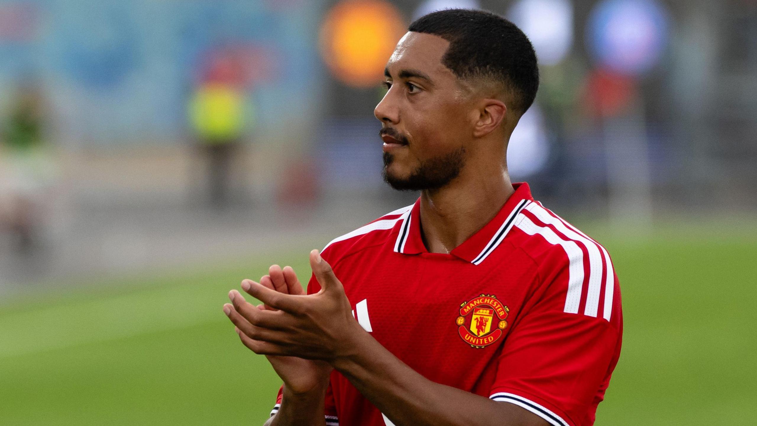 Youri Tielemans applauding fans