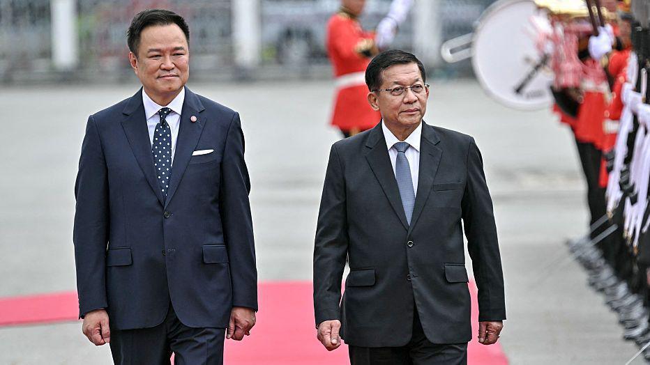 Myanmar's President Min Aung Hlaing and Thailand's Prime Minister Anutin Charnvirakul inspect a guard of honour at a welcoming ceremony on a red carpet