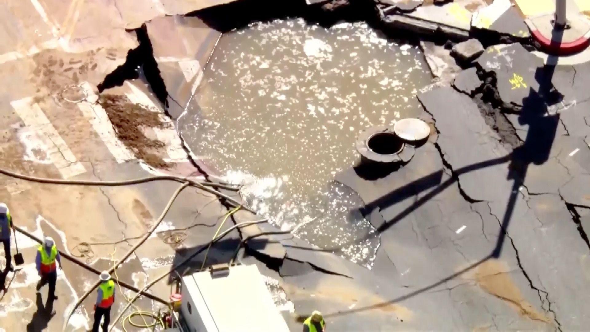 A sinkhole filled with water in West Hollywood.