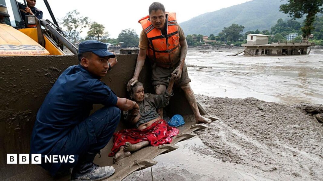Rescue teams pull survivors from thick mud Rescue teams pull survivors from thick mud
