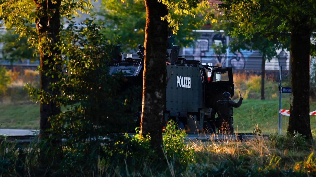 Manhunt after shooting at Swiss rave kills woman, 22, and injures five Manhunt after shooting at Swiss rave kills woman, 22, and injures five