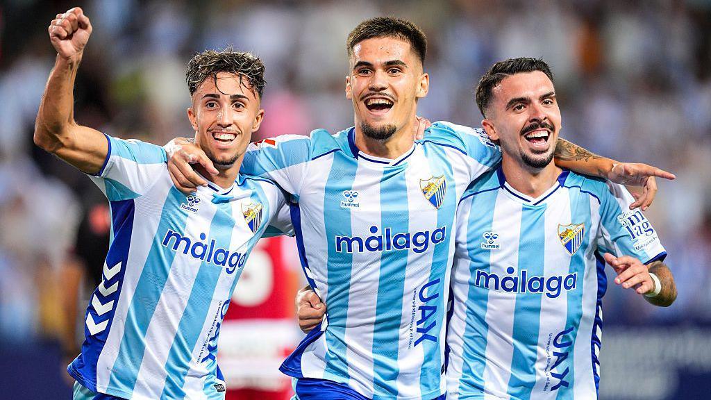 Malaga players celebrating