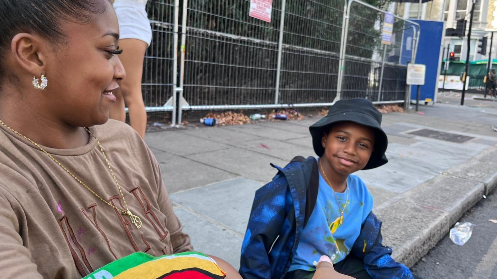 Mum and son on the pavement