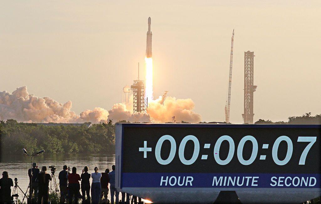 The rocket blasting off carrying the telescope