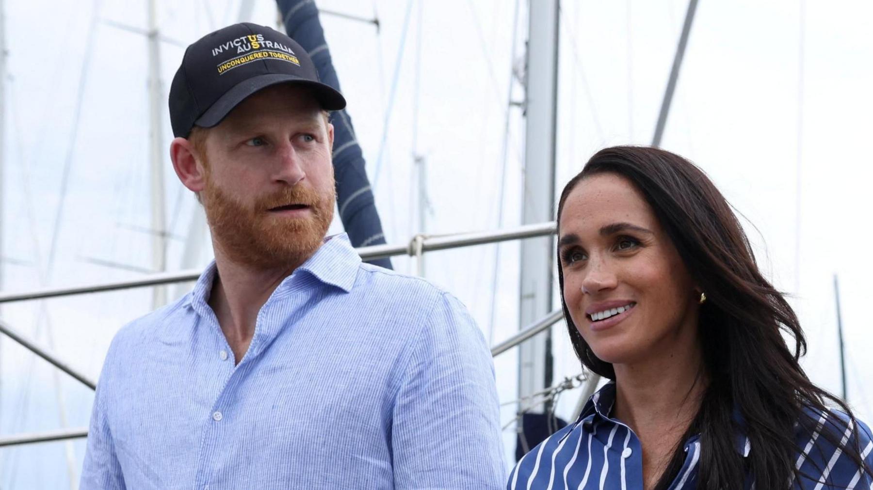 Britain's Prince Harry and Meghan, the Duke and Duchess of Sussex, disembark after sailing on Sydney Harbour with veterans from the Invictus Australia community, in Sydney, Australia.