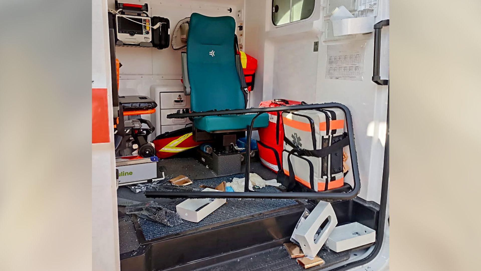 Inside an ambulance, vital equipment is strewn on the floor following a drone attack while out attending to a patient