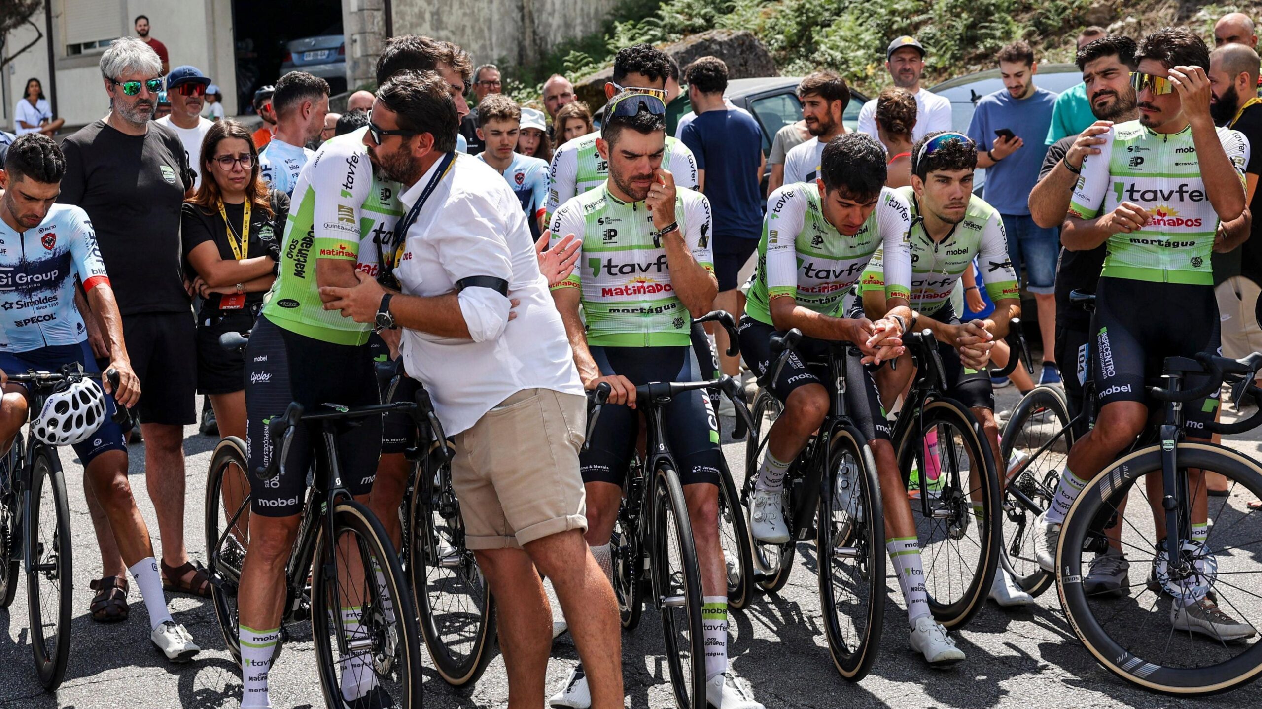 cyclists consoling one another