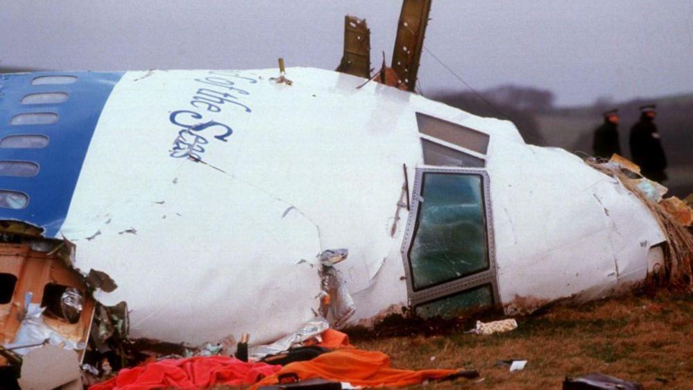 Officials inspect the wreckage of Pan Am flight 103 December 21, 1988 in Lockerbie, Scotland.