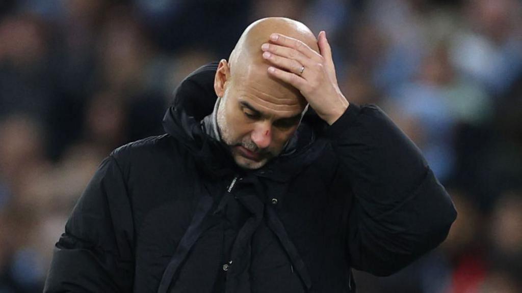 Pep Guardiola looking stressed.