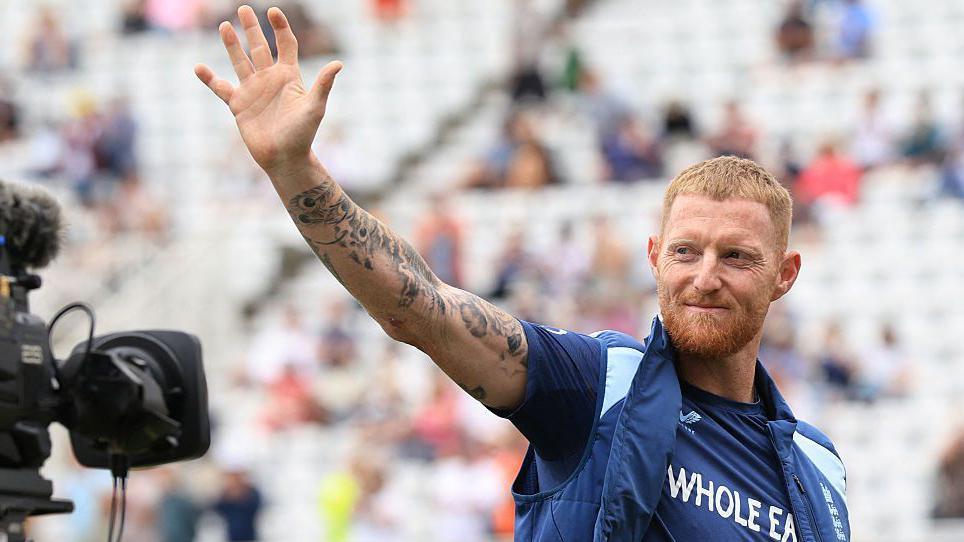 Ben Stokes waves to the crowd while being filmed