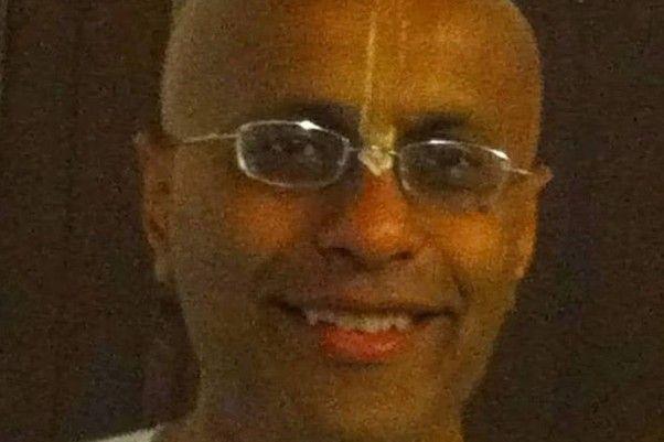 A close up of Nabhi Das, he is wearing glasses and smiling.