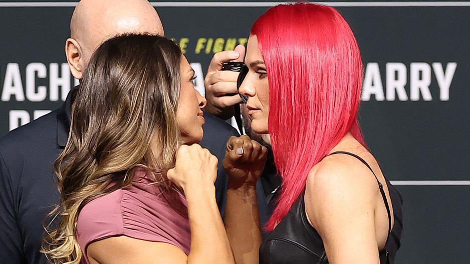 Mackenzie Dern holds up her fists as she faces off with Gillian Robertson
