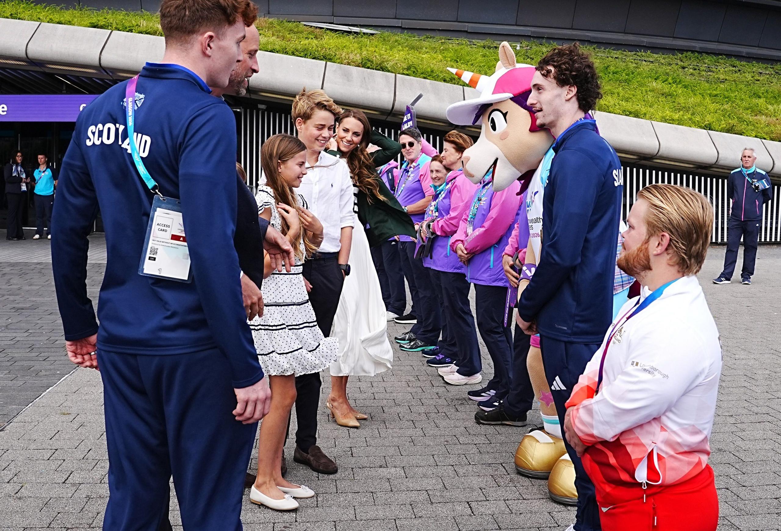 The royal family meet a row of Commonwealth Games volunteers outside the Hydro in Glasgow