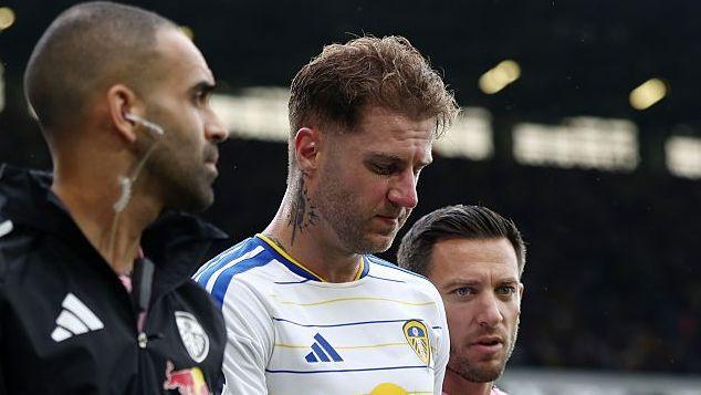 Joe Rodon limps off with a hamstring injury at Elland Road.