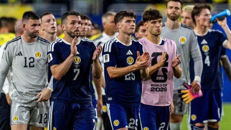 Scotland's John McGinn (L) And Findlay Curtis (R) applaud the fans at full time during a 2026 FIFA World Cup Group C match between Scotland and Brazil at the Miami Stadium, on June 24, 2026, in Miami, United States