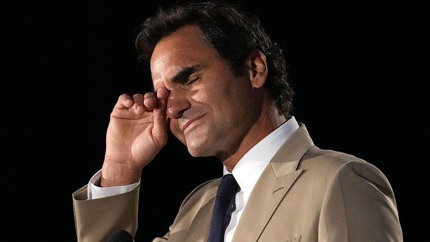 Roger Federer wipes away tears during his induction into the International Tennis Hall of Fame