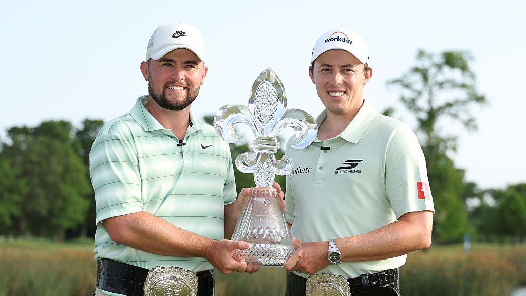 Alex and Matt Fitzpatrick pose with the trophy after winning the Zurich Classic on the PGA Tour in April 2026