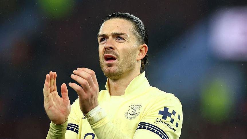 Jack Grealish applauds fans following the Premier League win at Aston Villa in January