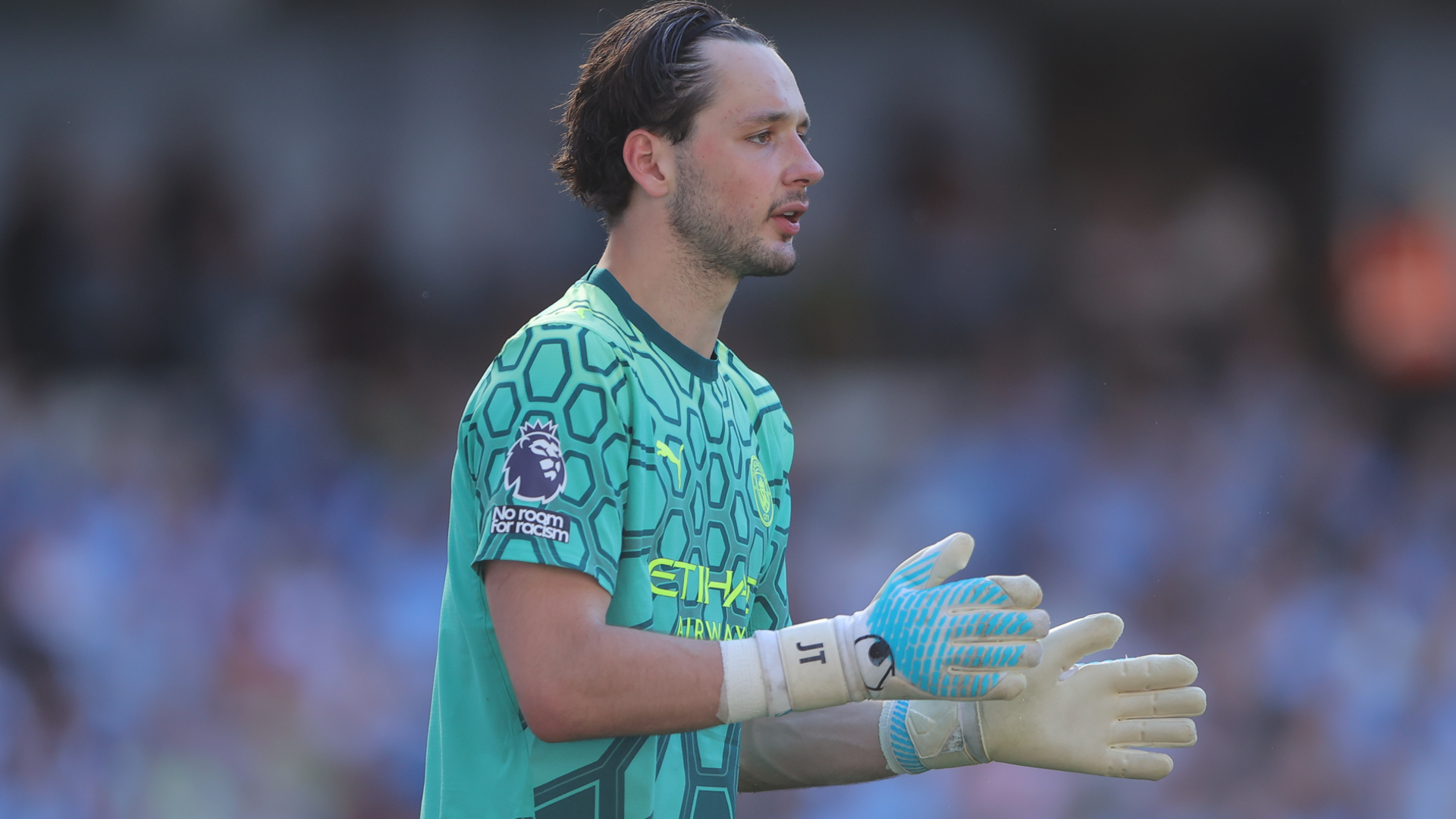 James Trafford in a Manchester City goalkeeper kit