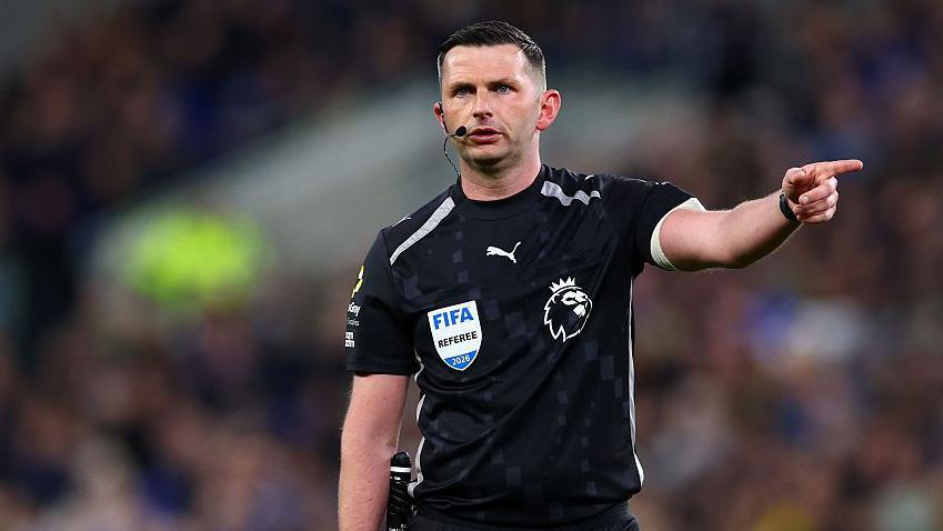 Referee Michael Oliver gestures during the Premier League match between Everton and Manchester City
