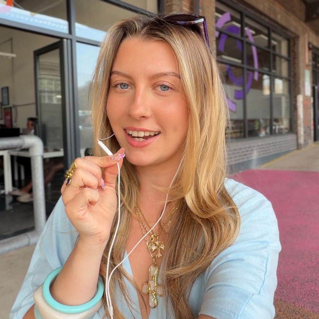Monique Wellman-Maso using wired headphones