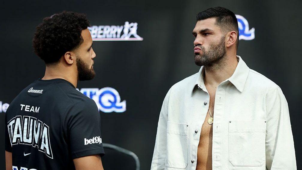 Moses Itauma and Filip Hrgovic look at each other at the news conference