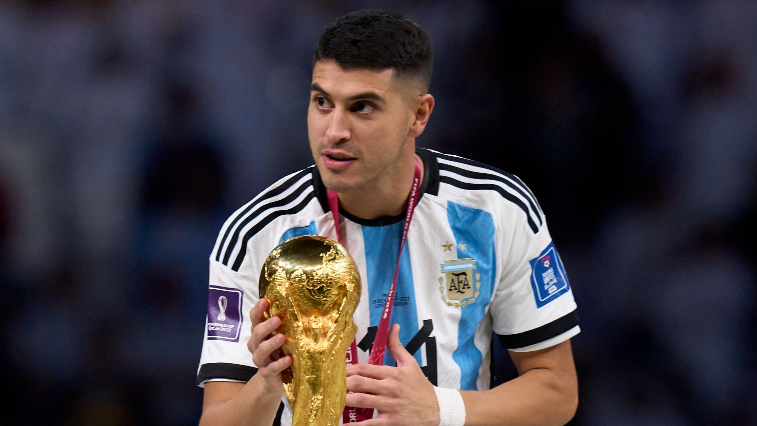 Exequiel Palacios of Argentina touches the World Cup after the final in 2022