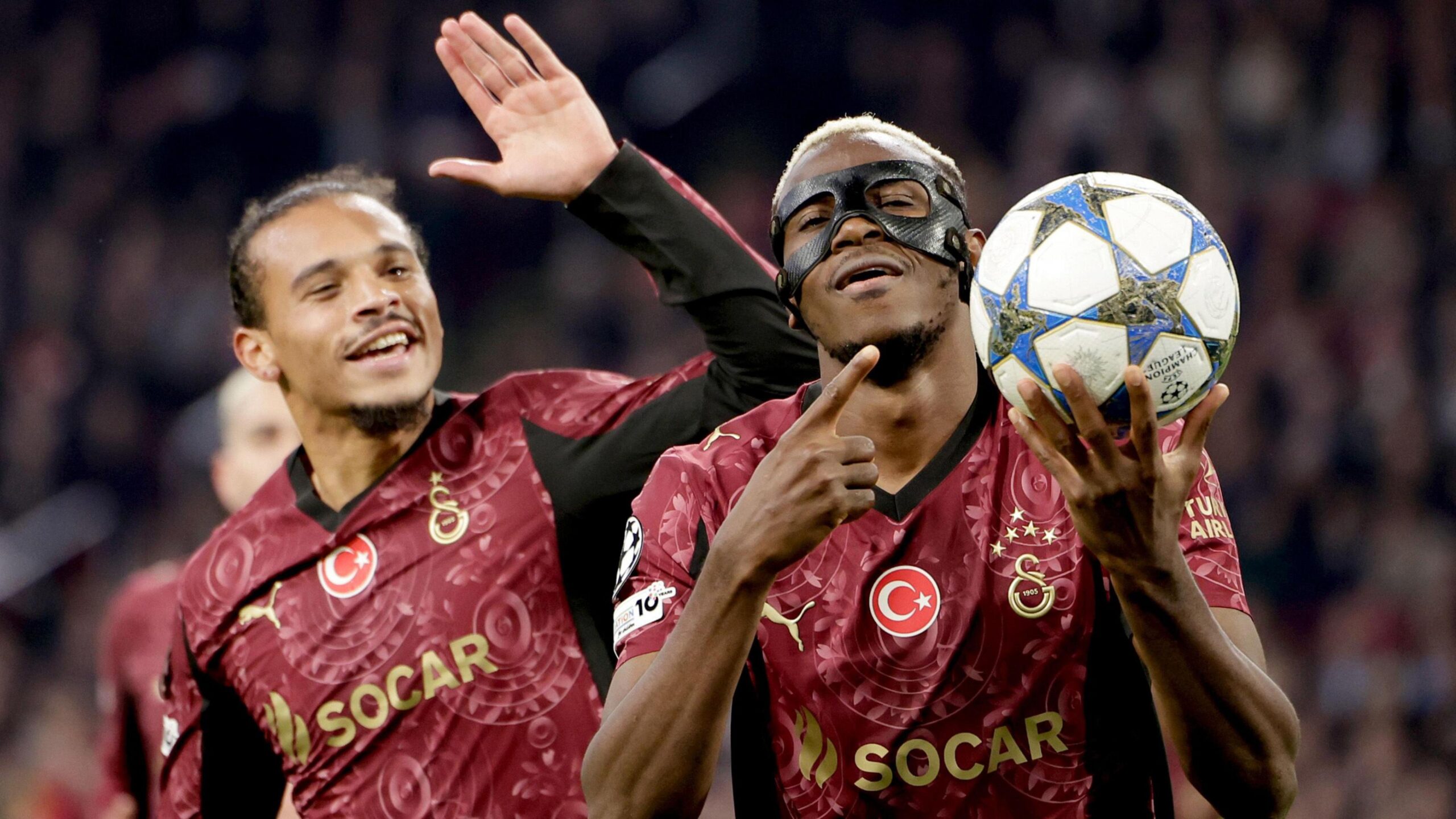 Galatasaray's Leroy Sane (left) and Victor Osimhen (right) celebrate the latter's goal against Ajax in the Champions League