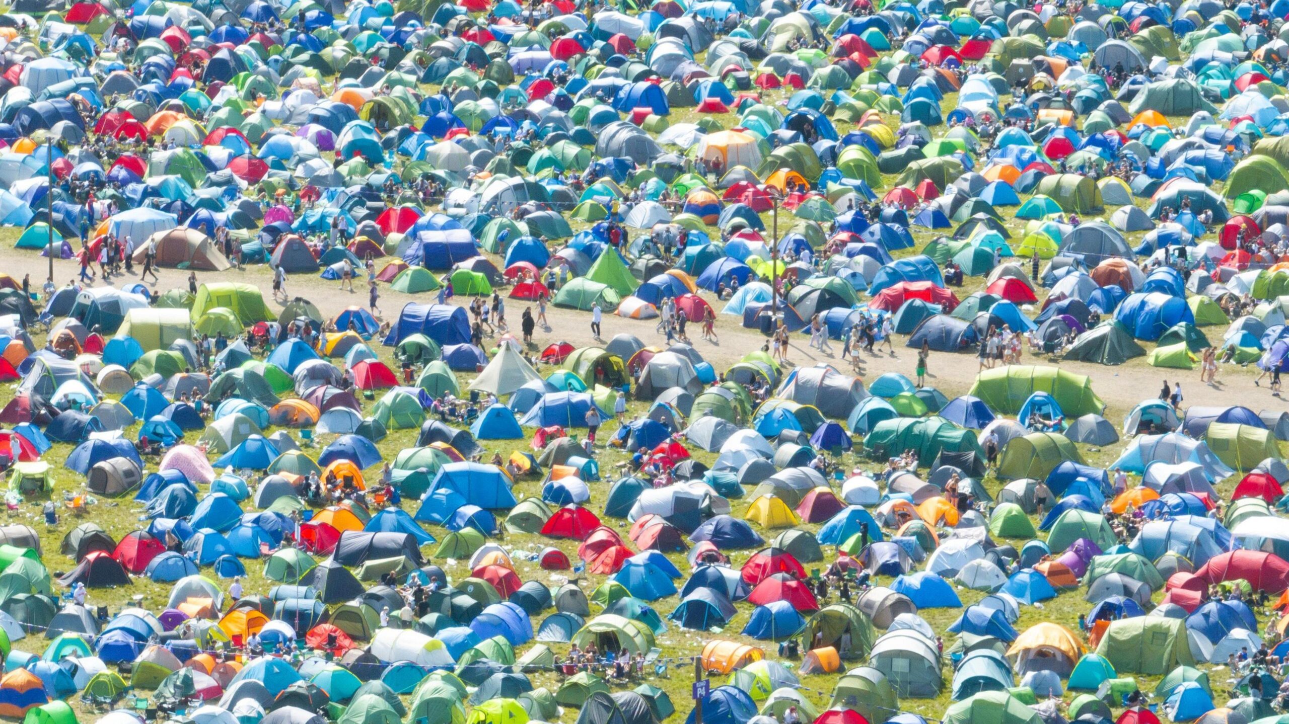 An aerial view of tents in fields at Reading Festival.