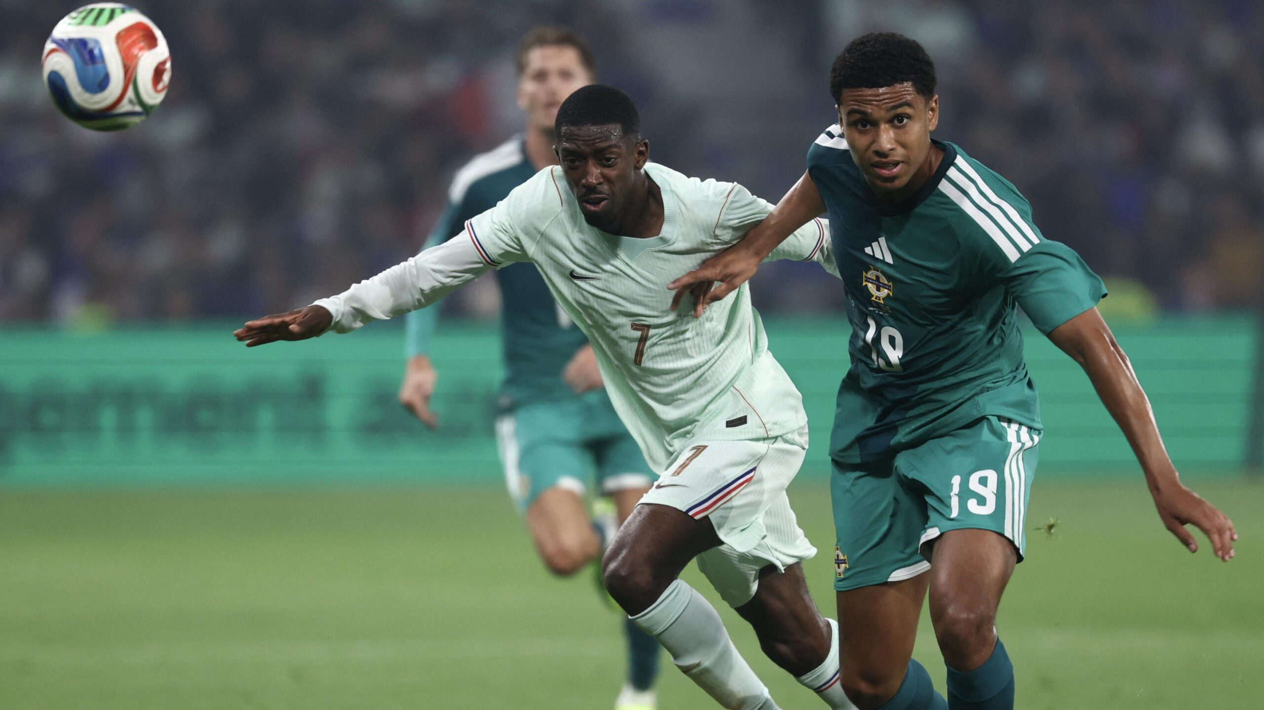 Shea Charles and Ousmane Dembele in close proximity during a friendly between Northern Ireland and France