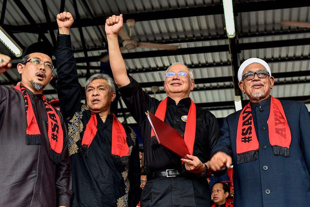 Malaysian Prime Minister Najib Tun Razak gestures while addressing ethnic Rohingya Muslim refugees during a gathering at Titiwangsa Stadium in Kuala Lumpur on December 04, 2016 against the persecution of Rohingya Muslims in Myanmar. (Photo by Chris Jung/NurPhoto via Getty Images)