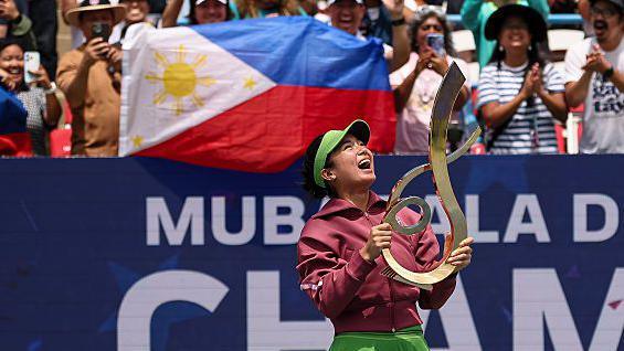 Alexandra Eala holds the trophy after beating Jessica Pegula to win the Mubadala DC Open in 2026