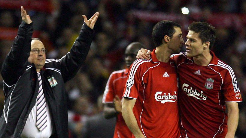 Rafael Benitez with his arms in the air and Alonso with his arm around Arbeloa while playing for Liverpool