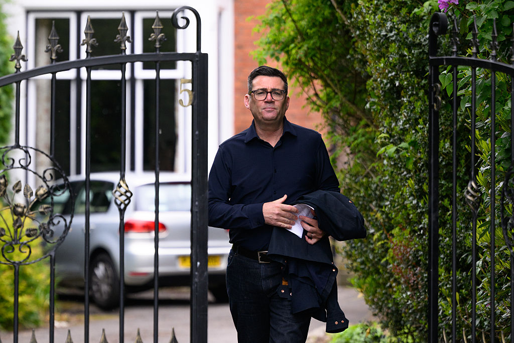 Andy Burnham, here shown leaving his home, wants a land value tax