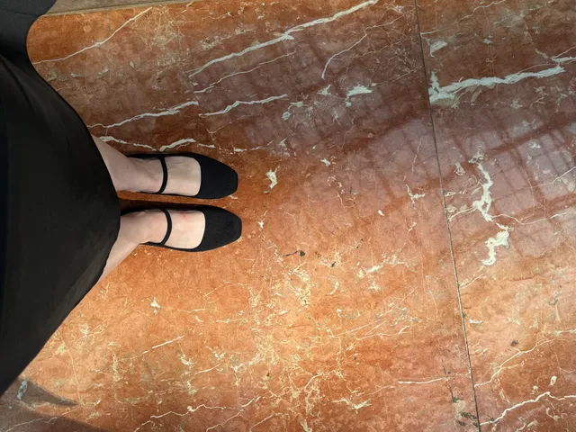 Image may contain: Floor, Slate, Clothing, Footwear, Sandal, Path, Walkway, Shoe, Person, Flagstone, Flooring, and Adult