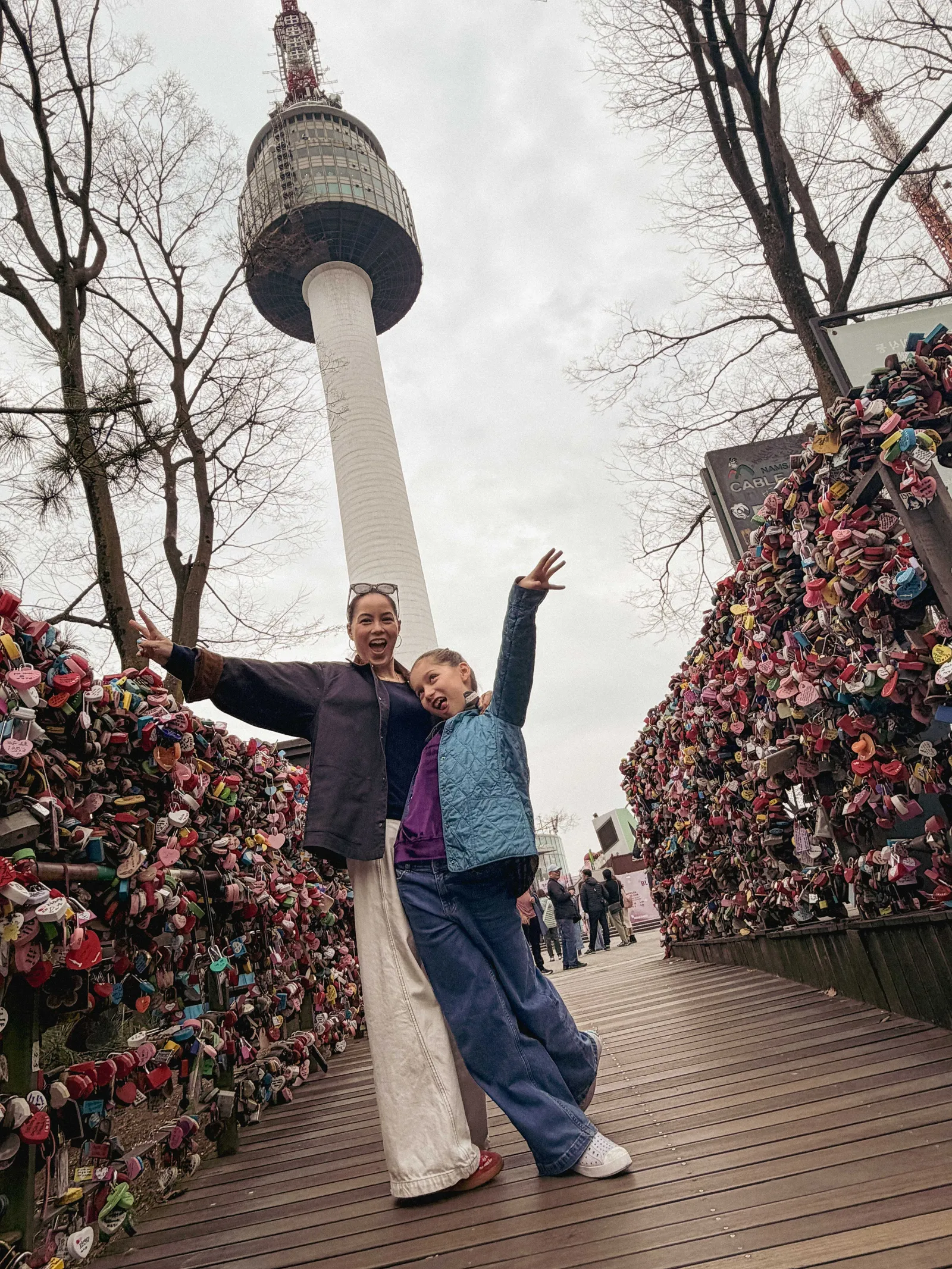 Image may contain Architecture Building Tower Landmark Adult Person and N Seoul Tower