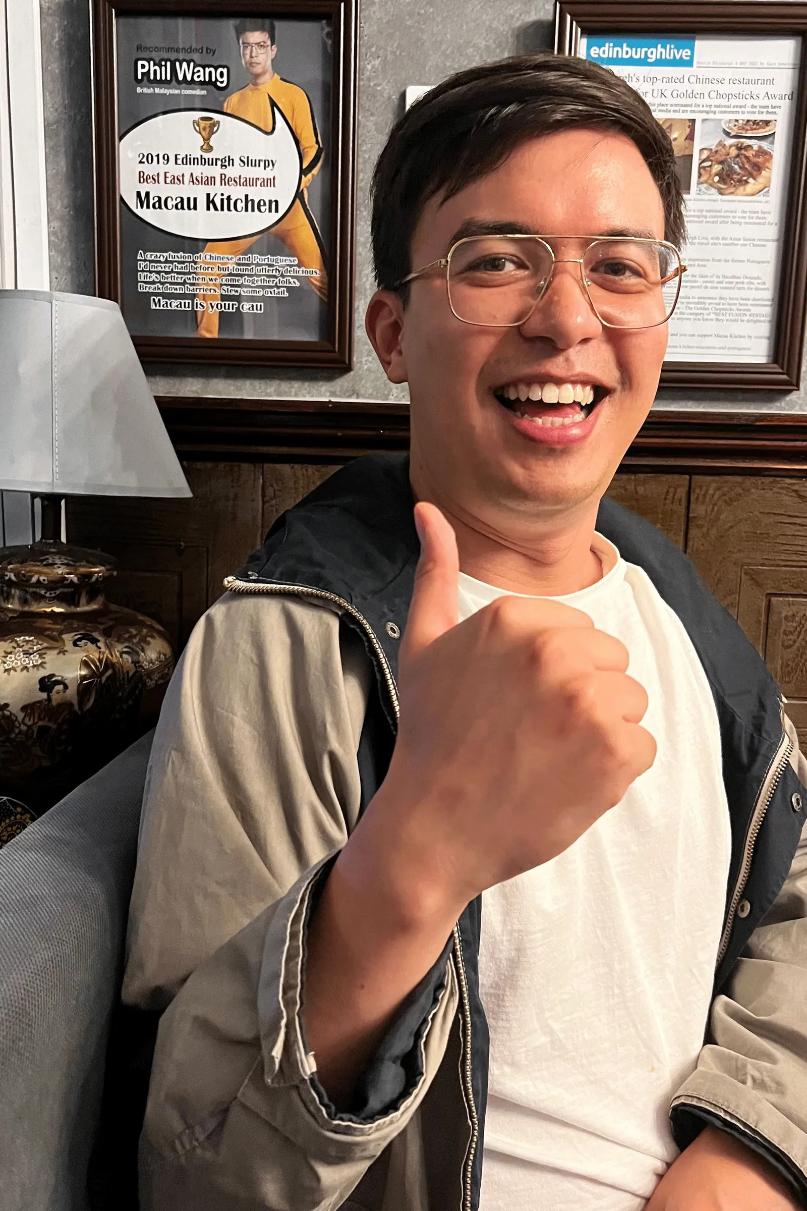 Image may contain Body Part Finger Hand Person Face Happy Head Smile Accessories Glasses Adult and Photography