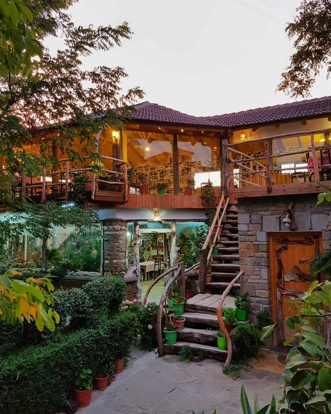 Image may contain Architecture Building Hotel Resort House Housing Villa Plant Person Garden Nature and Outdoors