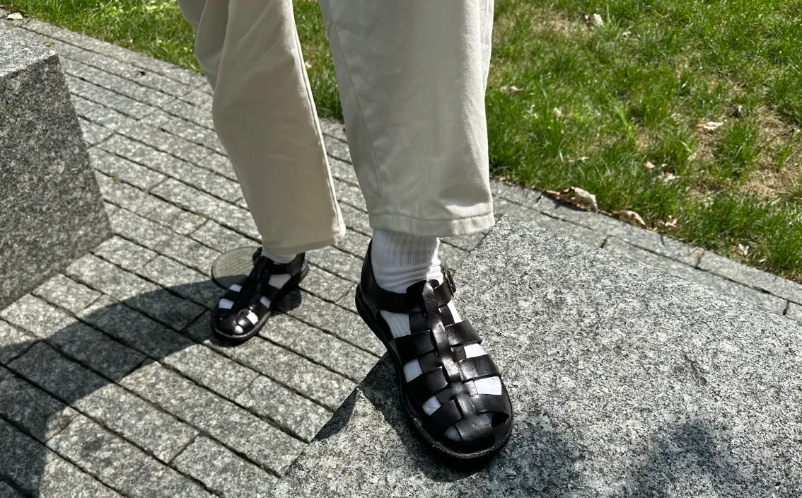 Image may contain Clothing Footwear Sandal Shoe Sneaker Child Person and Walking