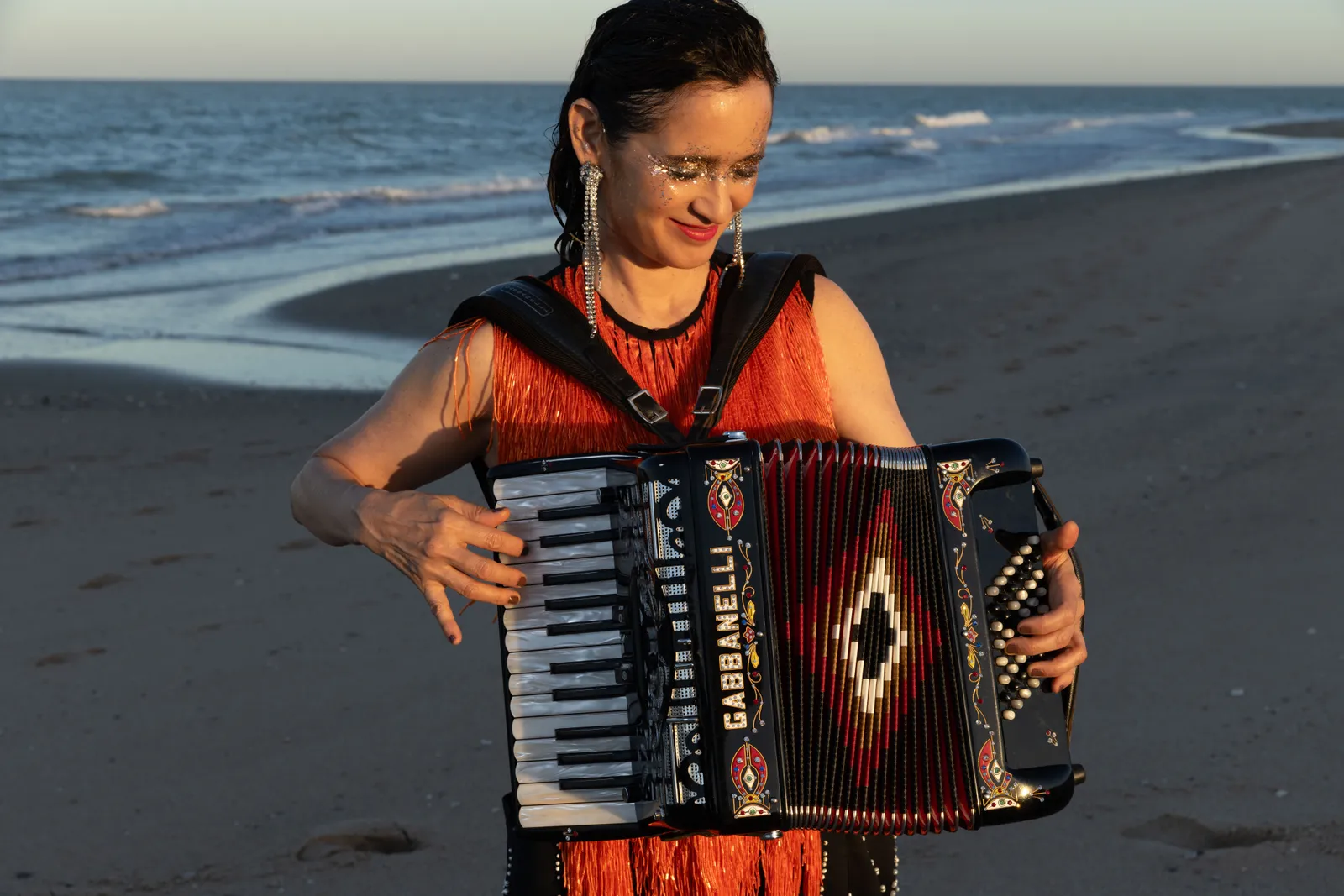 Image may contain Julieta Venegas Adult Person and Musical Instrument