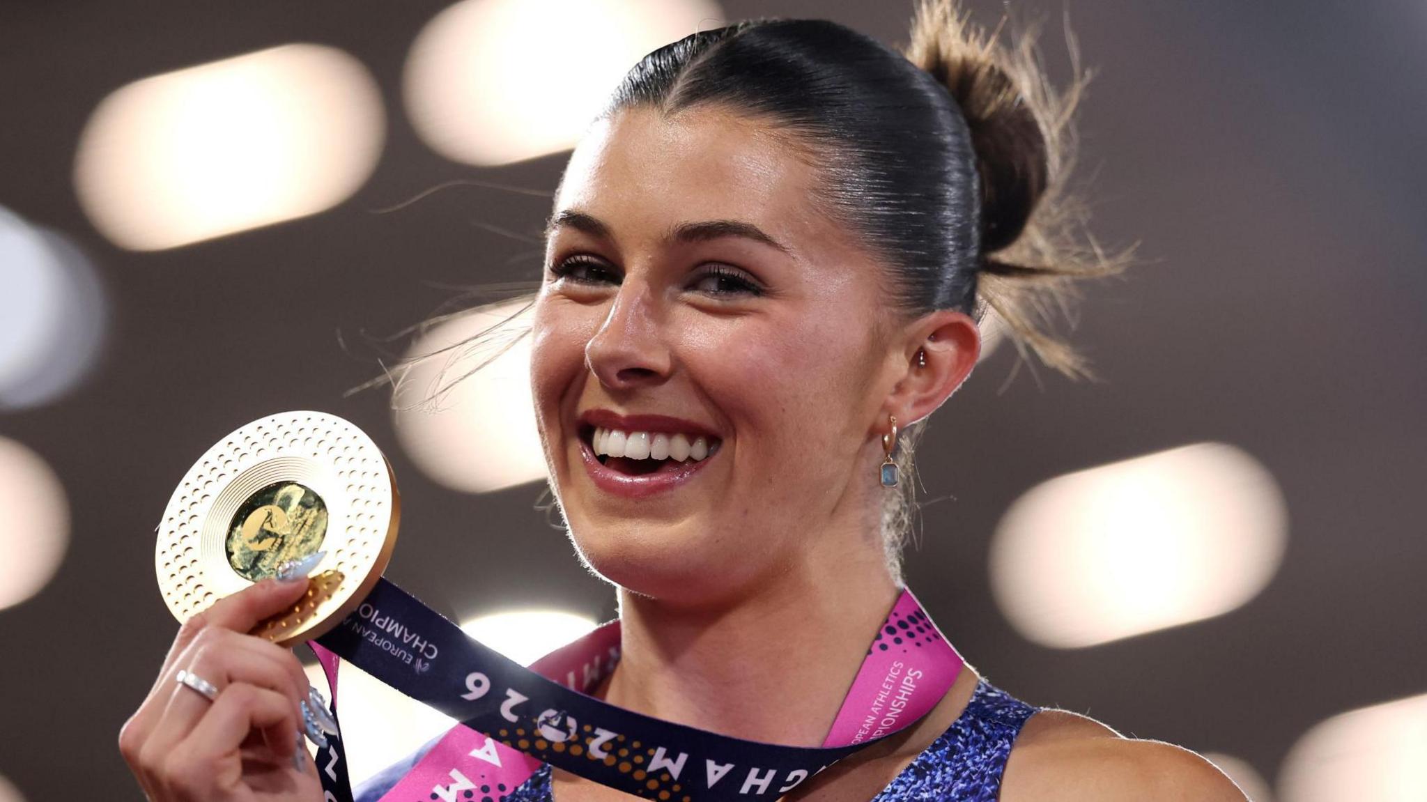 Amy Hunt celebrates with her gold medal in Birmingham