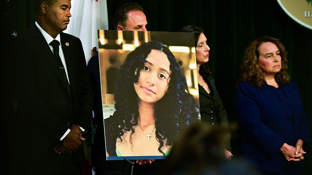 A portrait of the late Celeste Rivas Hernandez is shown during a press briefing by Los Angeles County District Attorney Nathan J. Hochman (out of frame) on the case against singer D4vd in Los Angeles, on April 20, 2026.