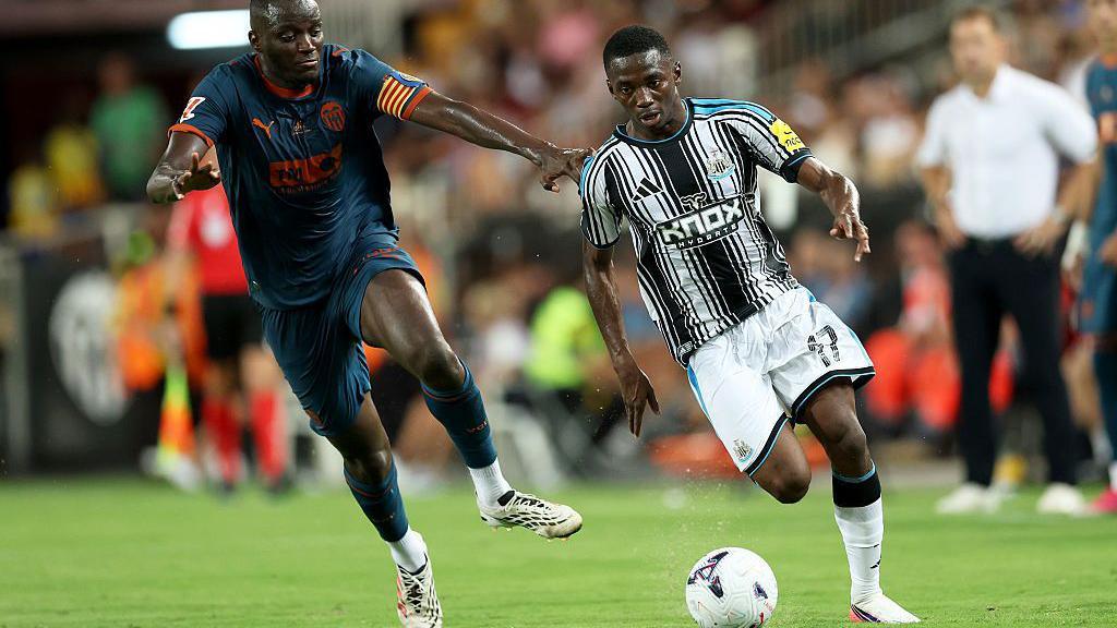 Newcastle's Bazoumana Toure takes on Valencia's Mouctar Diakhaby in a pre-season friendly