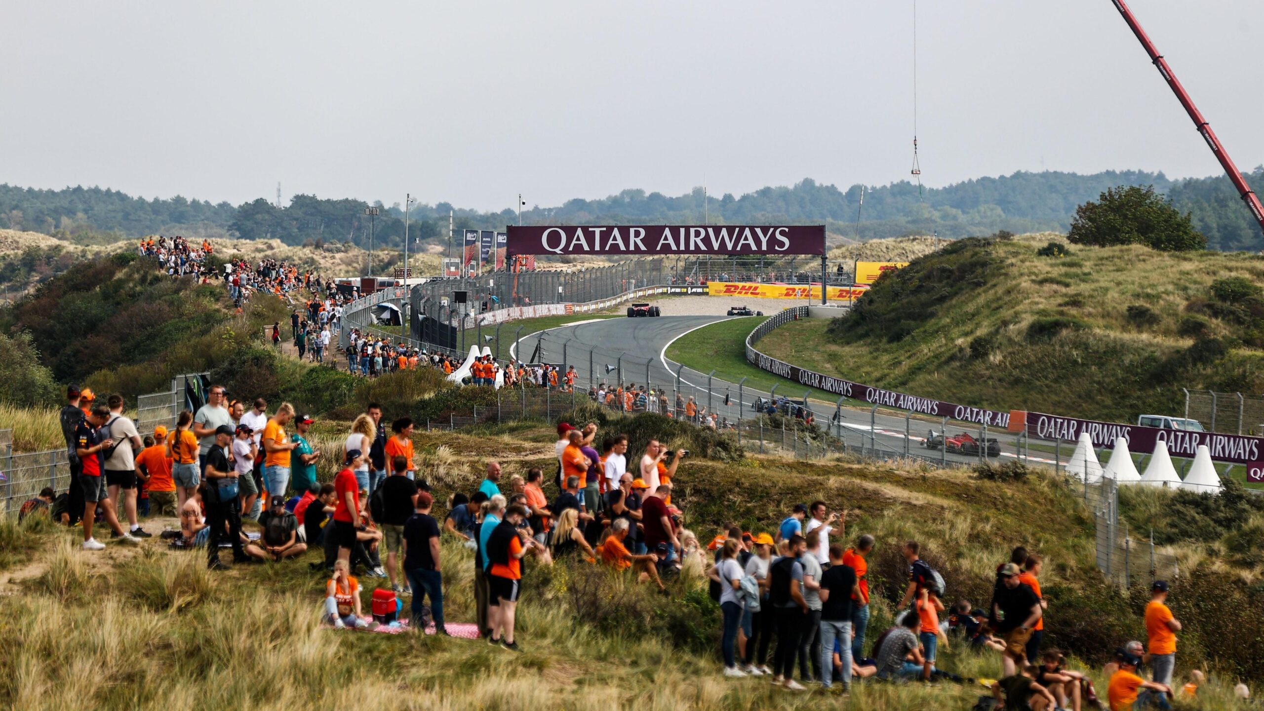 Fans stood on sand dunes watch the 2022 Dutch Grand Prix