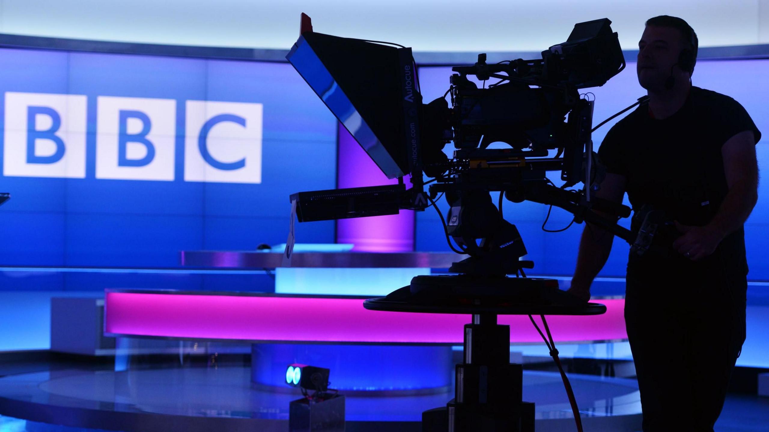 A BBC camera operator in a studio