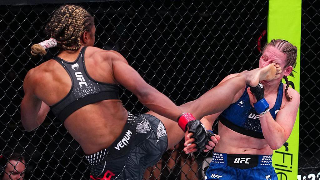 Shanelle Dyer lands a kick onto the face of Elise Reed