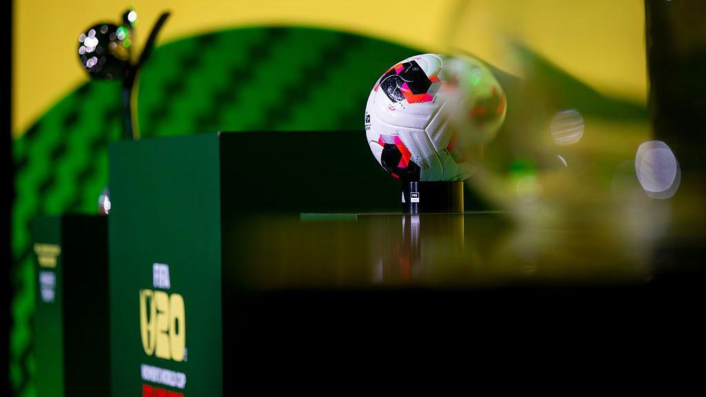 Fifa Women's U20s World Cup trophy and match ball sit on podiums